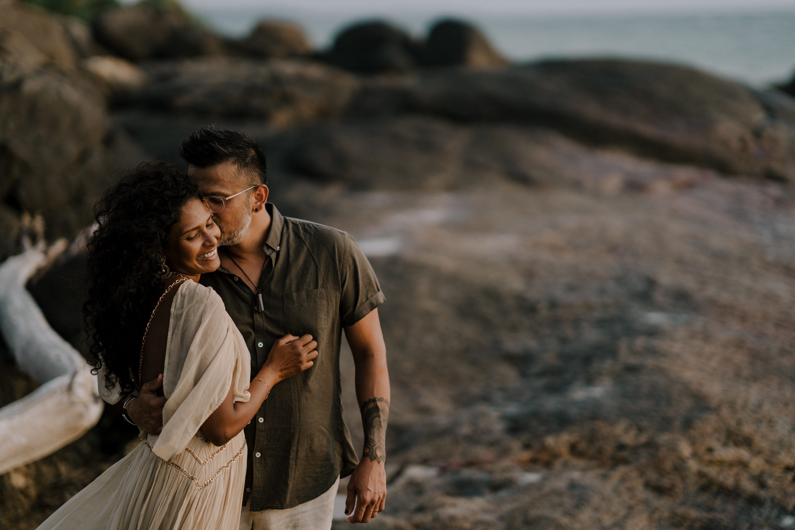 Nikki and Sanjay sharing a moment by the beach at their pre wedding shoot